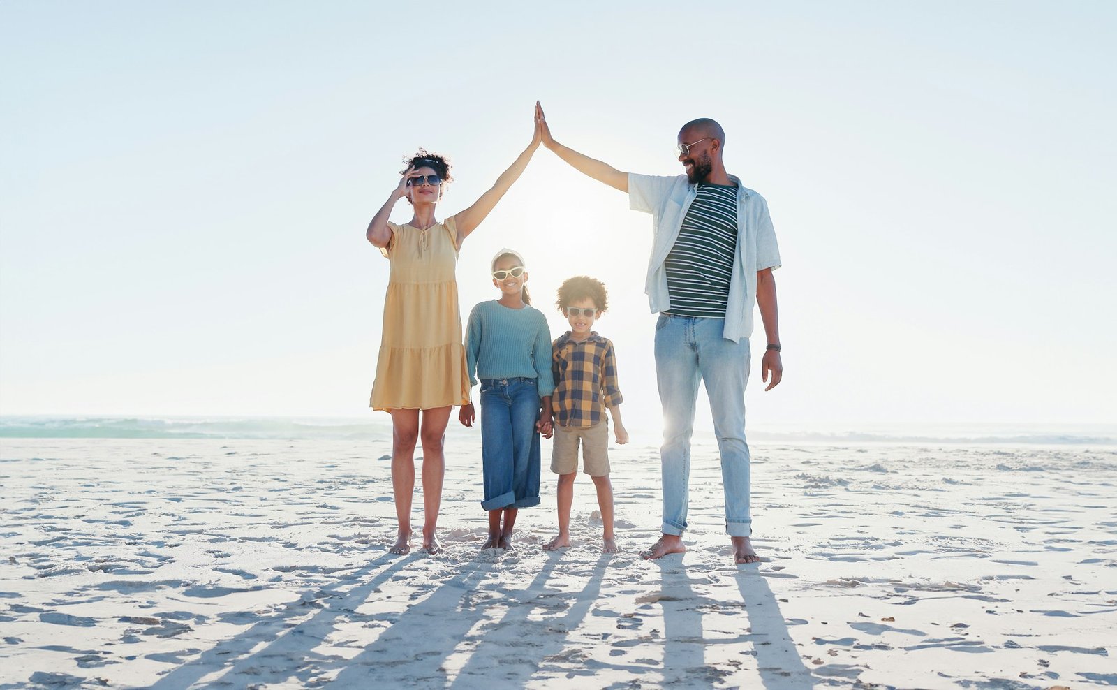 Smile, high five or insurance with a family on the beach together for security, travel or vacation.